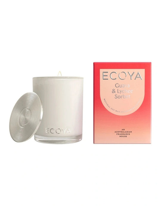 An ECOYA Guava & Lychee Sorbet scented candle with its lid off next to its packaging box.